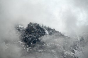 Part of the Teton Mountain Range covered in Fog
